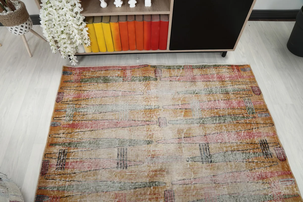 Overhead view of the rug, showing its rectangular shape and the overall abstract pattern