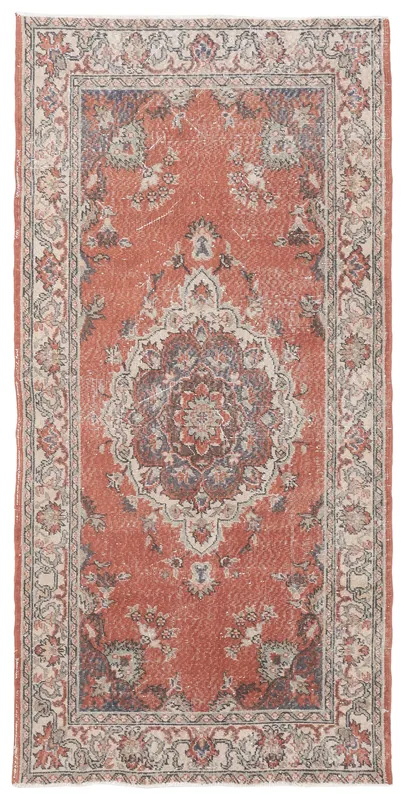Full top view of the rust medallion Anatolian runner on a white background