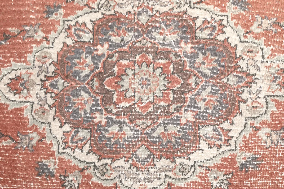 Close-up detail of the intricate floral patterns within the central medallion