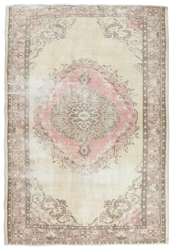 Full overhead view of the cream and rose vintage Anatolian rug with a central medallion.