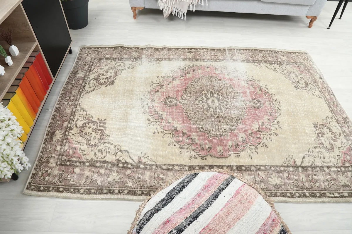 Full room view of the rug, showcasing its size and colors relative to furniture.