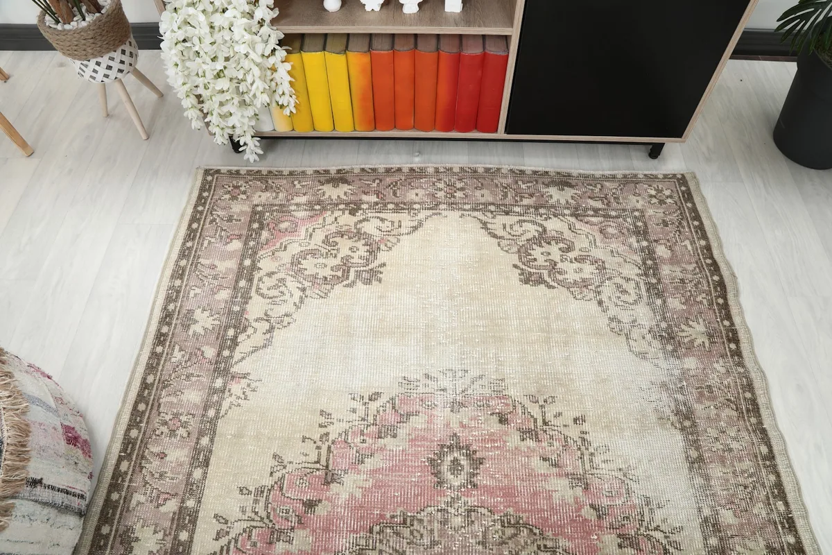 Overhead view showing the top portion of the rug, medallion, and border patterns.