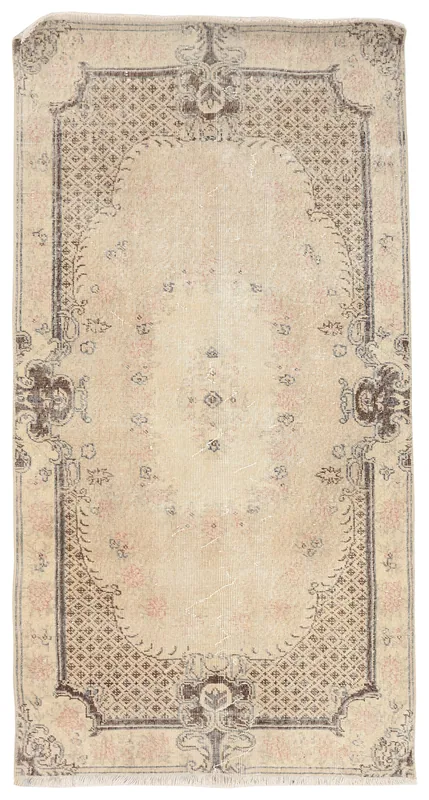 Full overhead view of the beige and charcoal vintage Anatolian rug