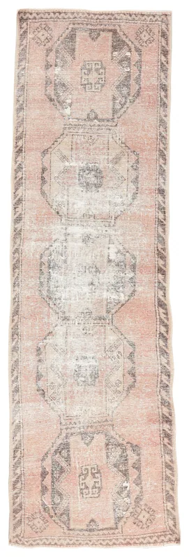 Full overhead view of the 3x11 vintage rose and charcoal geometric runner rug on a white background.