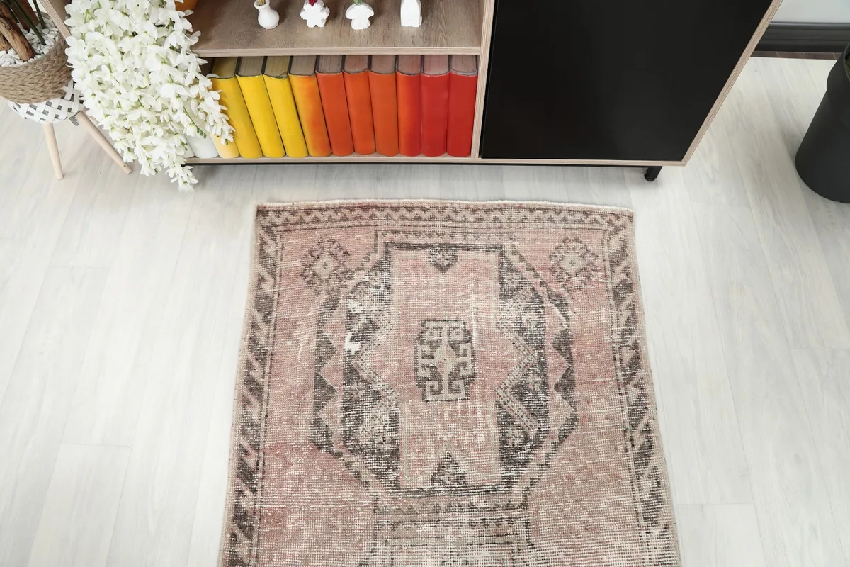 Overhead view of one end of the runner rug, displaying a prominent geometric medallion.
