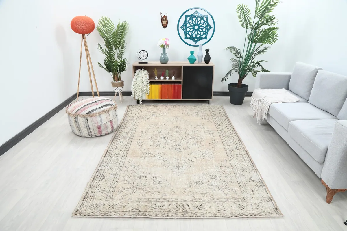 Vintage Anatolian rug displayed in a bright living room setting