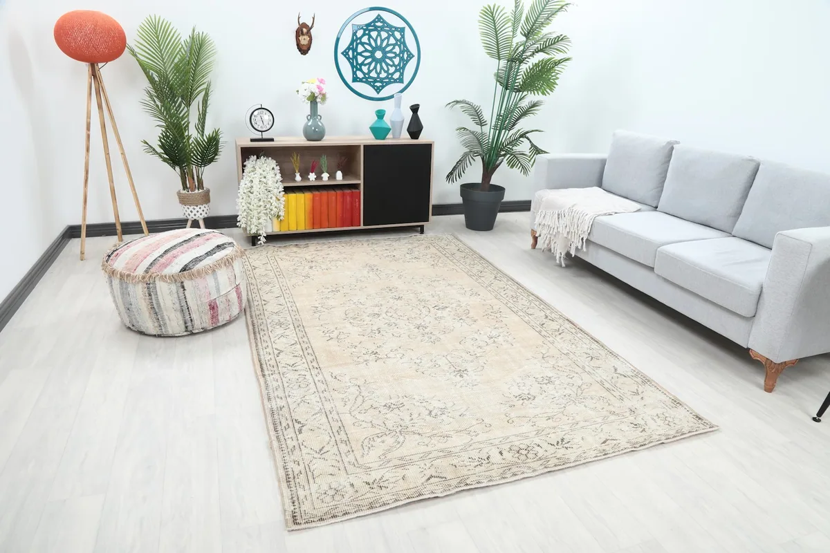 Angle view of the beige and charcoal rug in a modern living space