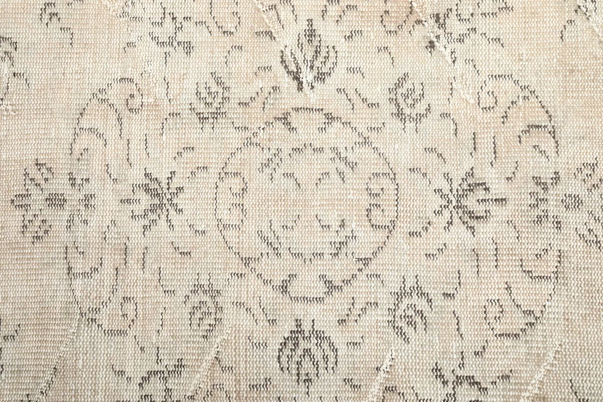 Detailed texture and pattern of the vintage hand-knotted wool rug