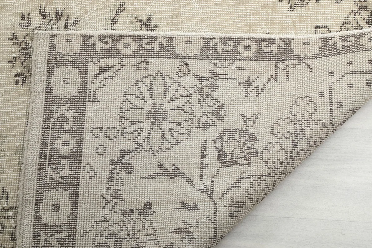 Detail of the rug's back, showcasing the tight knotting and craftsmanship