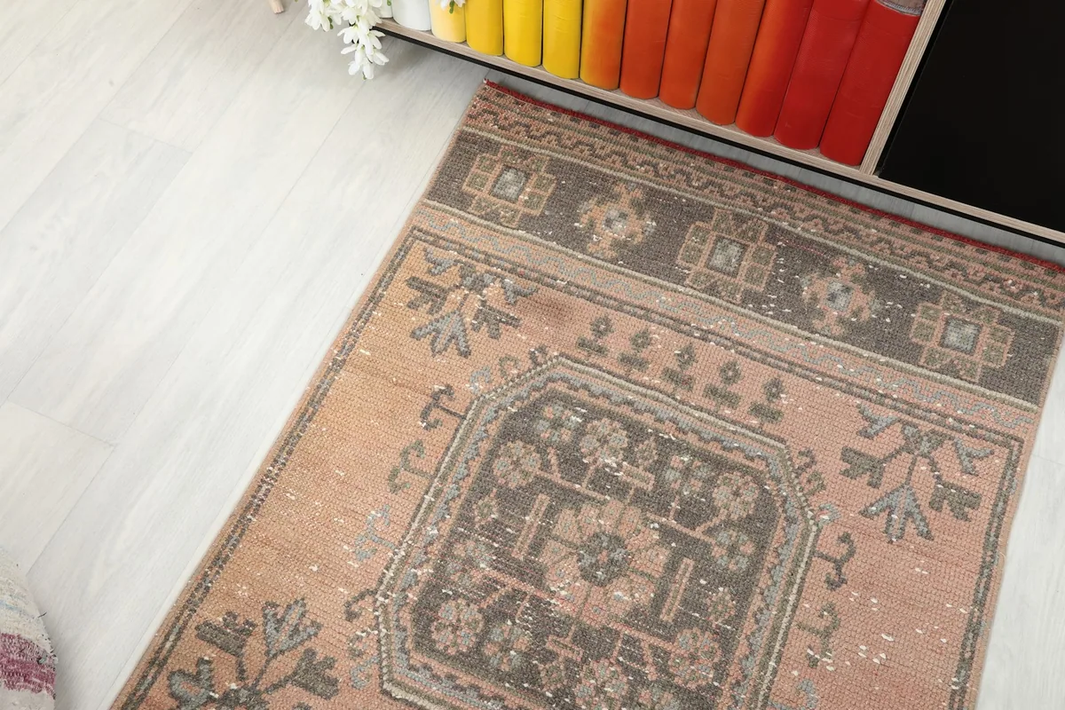 Top-down view of a section of the runner rug in a room, showing its placement near furniture.