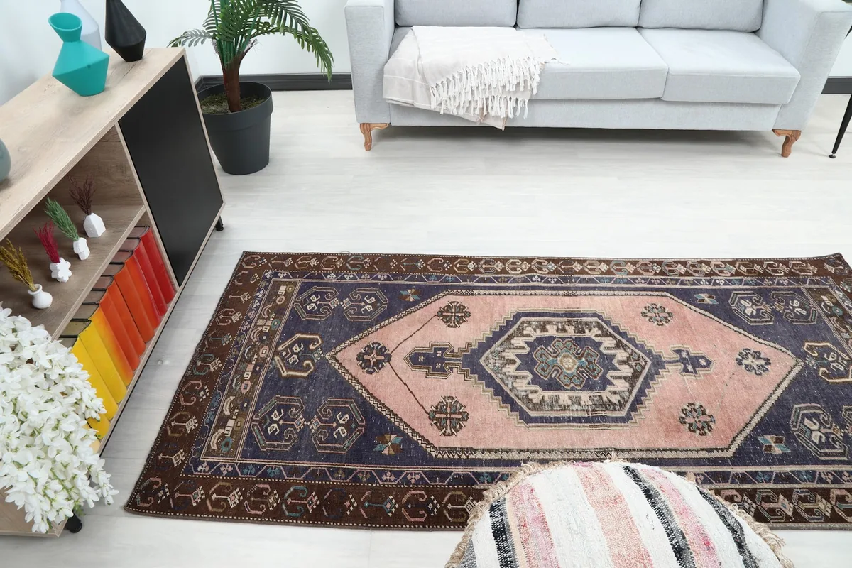 Room view of the vintage rug, showing its full length and colors