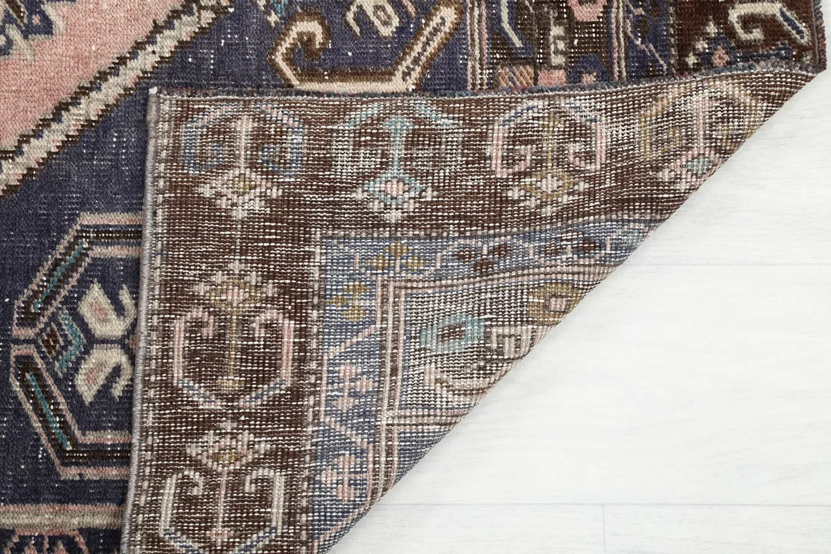 Detail of the rug's reverse side and hand-knotted construction