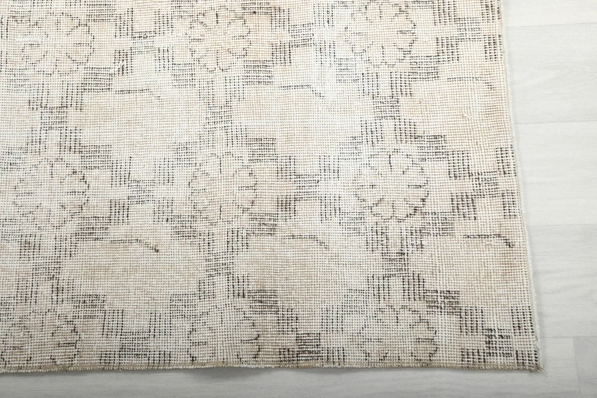 Detailed view of the hand-knotted wool pile and geometric motifs
