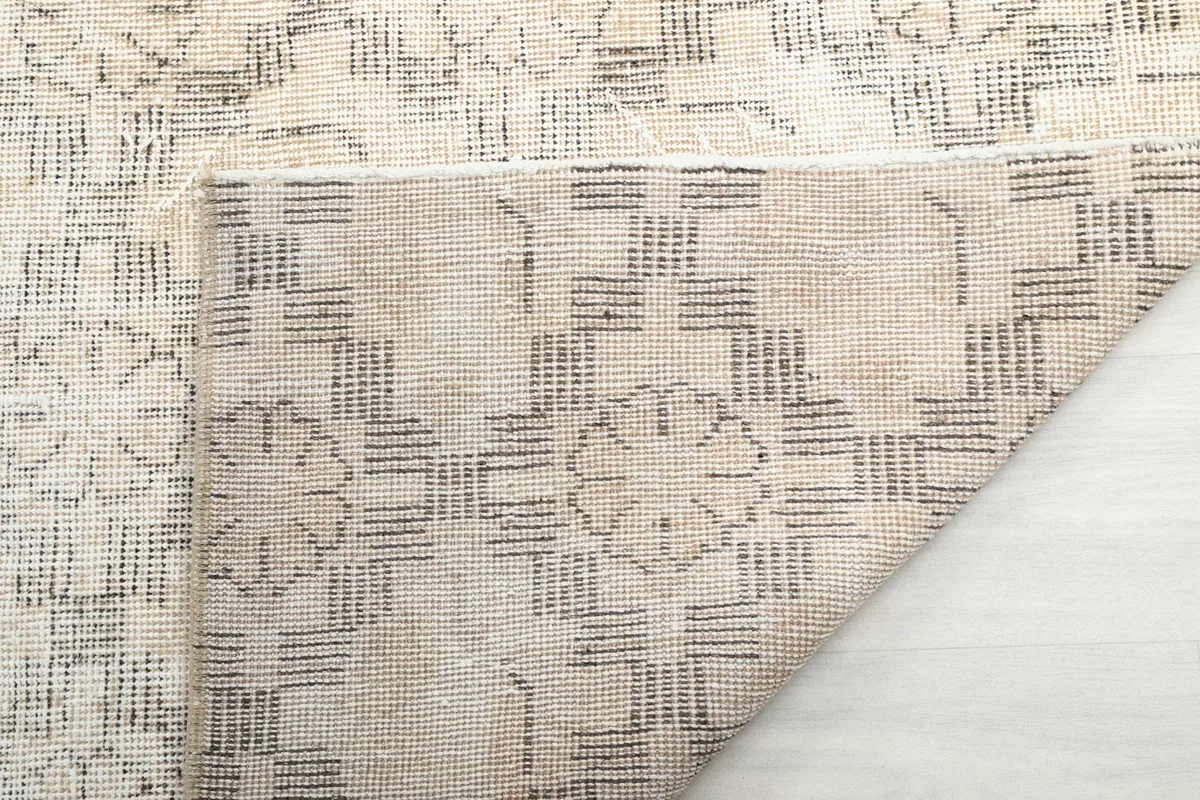 Detailed view of the rug's reverse side, showing the hand-knotted construction