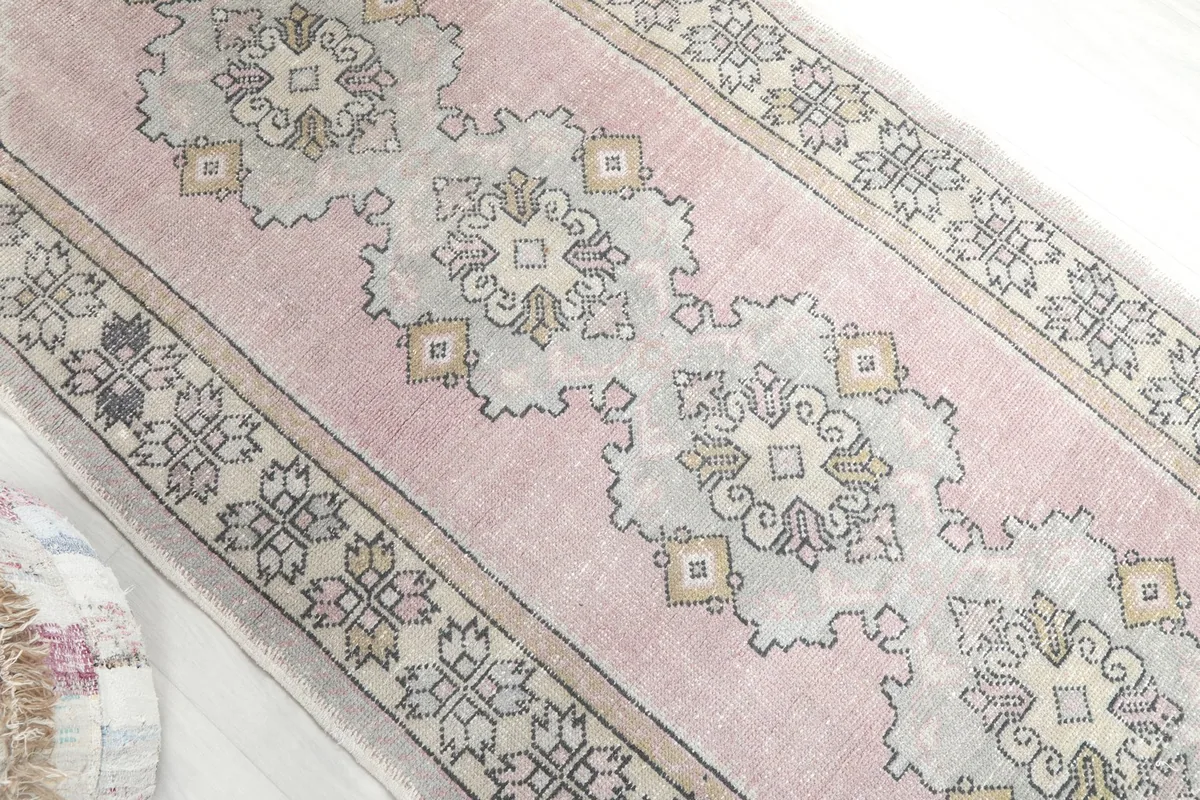 Overhead angled view showing the rose field and central geometric motifs