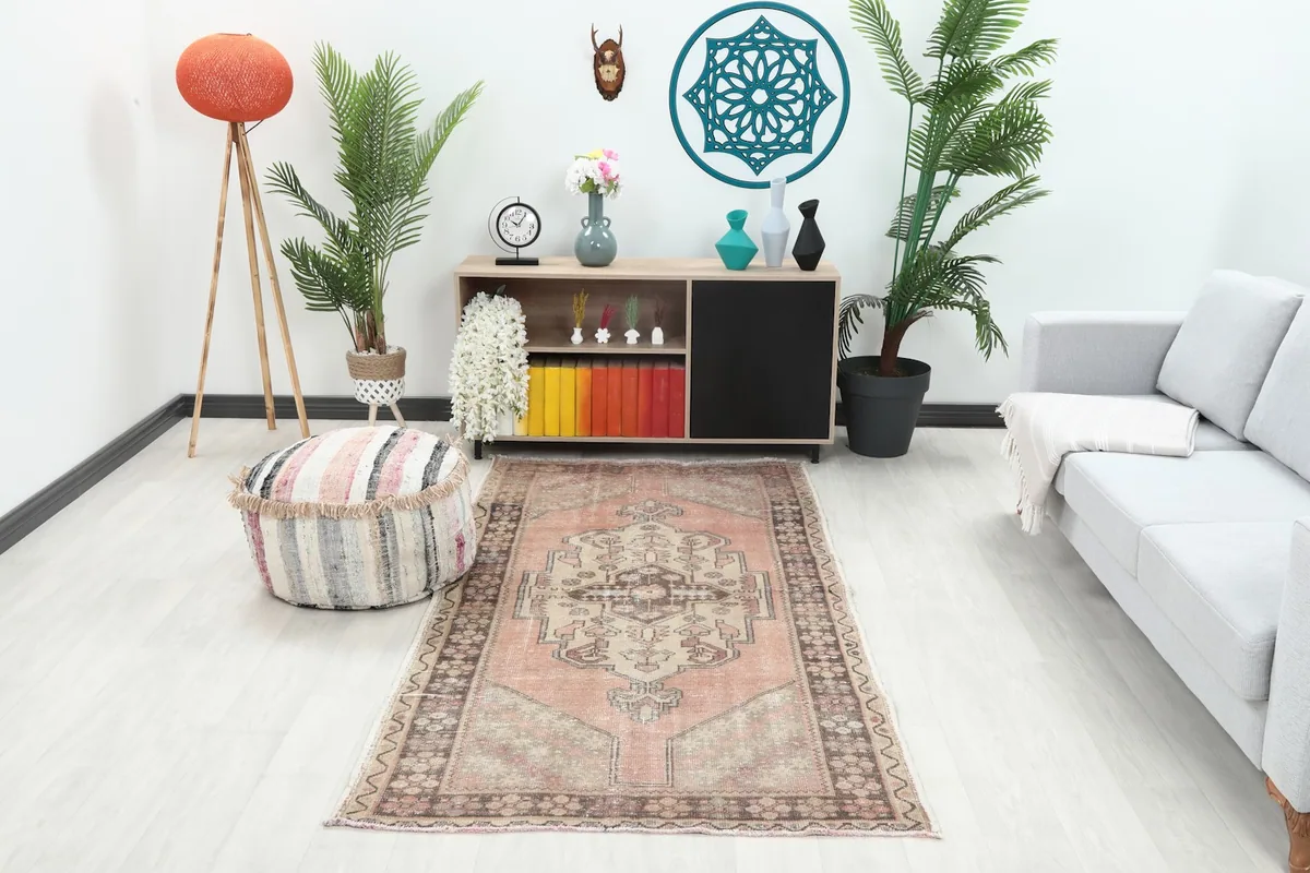 Vintage rose runner rug placed in a modern living room setting