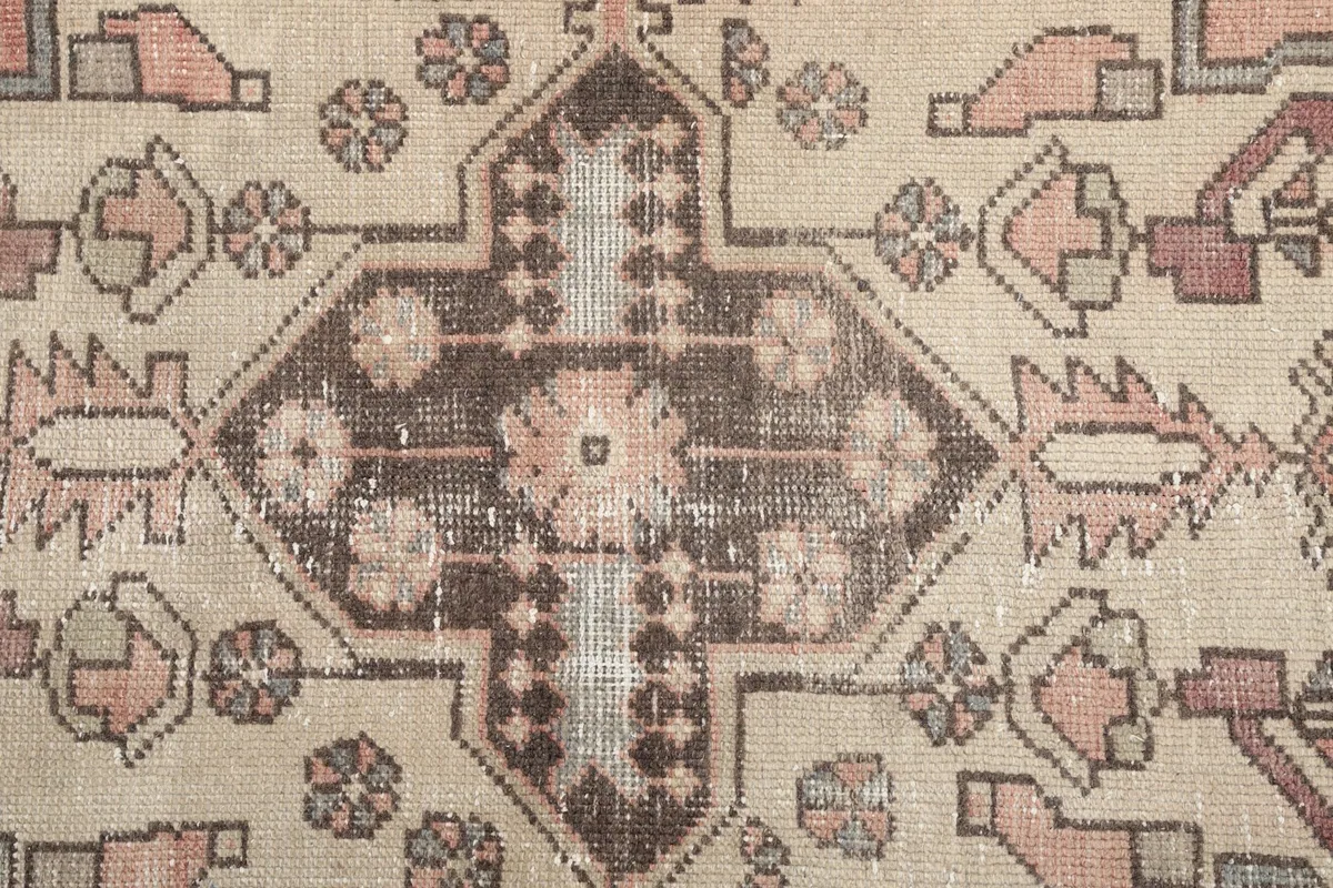Detailed shot of the central medallion's intricate floral and geometric motifs