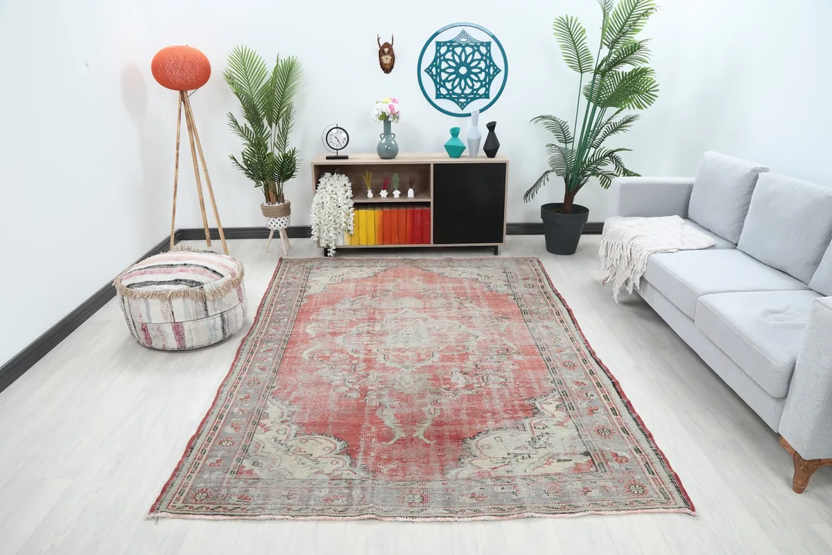 Vintage rose and gray Anatolian rug in a contemporary living room setting.