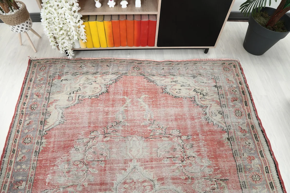 Overhead view of the rug from one end, showing the central medallion and border.