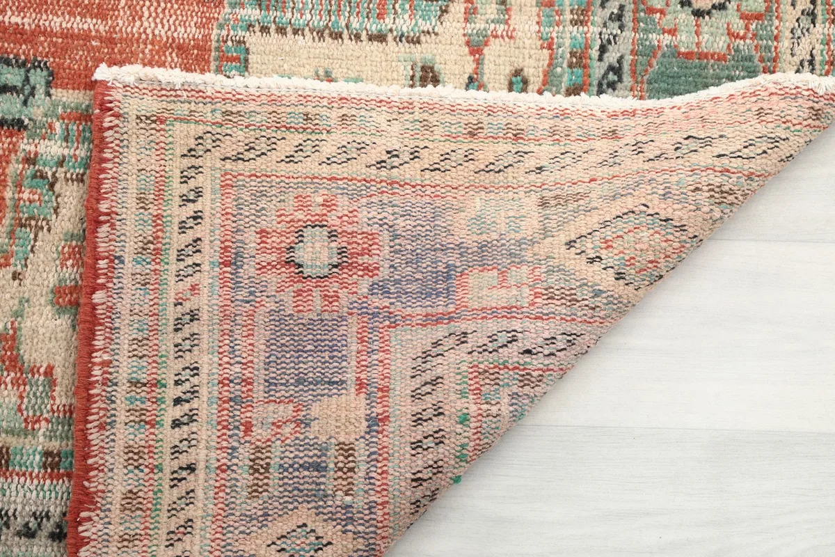Close-up of the rug's reverse side, showing the intricate hand-knotting and foundation weave