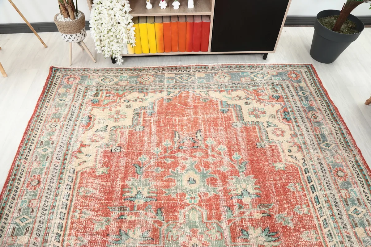 Overhead view of the rug's top half, showcasing the medallion and surrounding motifs