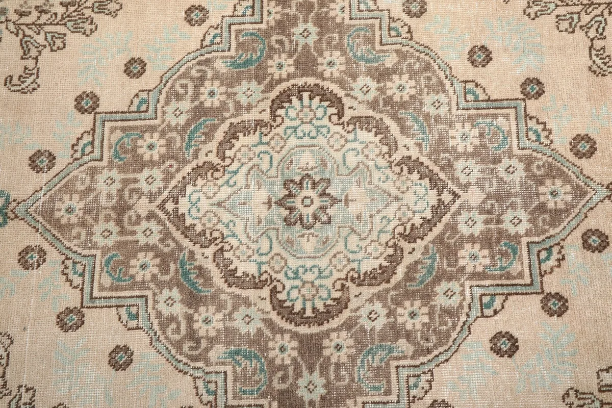 Close-up of the central medallion with intricate blue and brown details