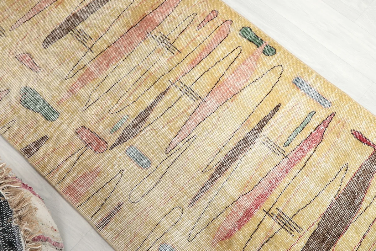 Overhead angled shot highlighting the varying abstract patterns and colors across the runner