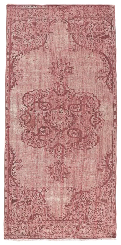 Full overhead view of the rose and brown medallion vintage Anatolian area rug