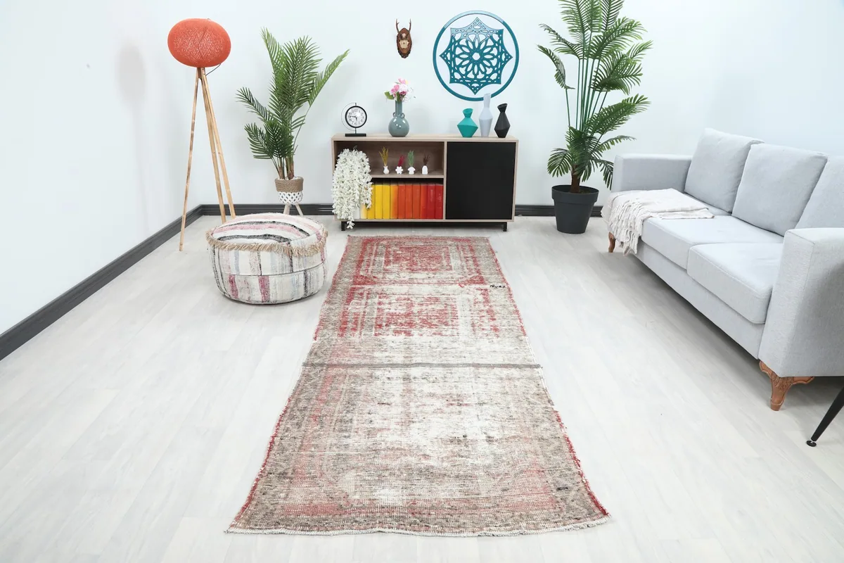 Vintage runner rug in a modern hallway setting, showing its long proportion