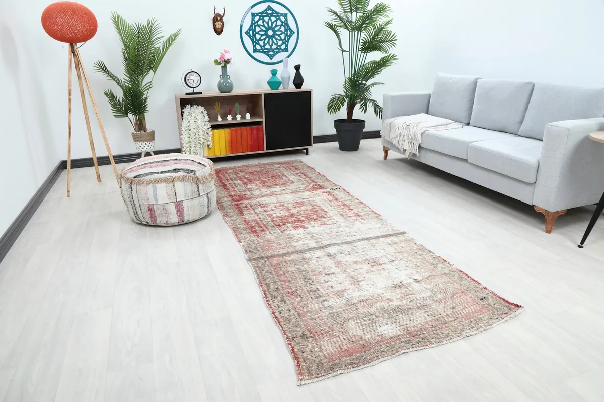 Angle view of the rose and gray runner rug placed in a contemporary living space