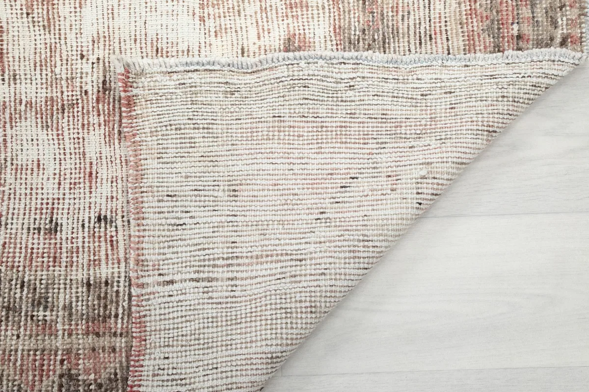 Another angle of the rug's reverse side, illustrating its construction and craftsmanship