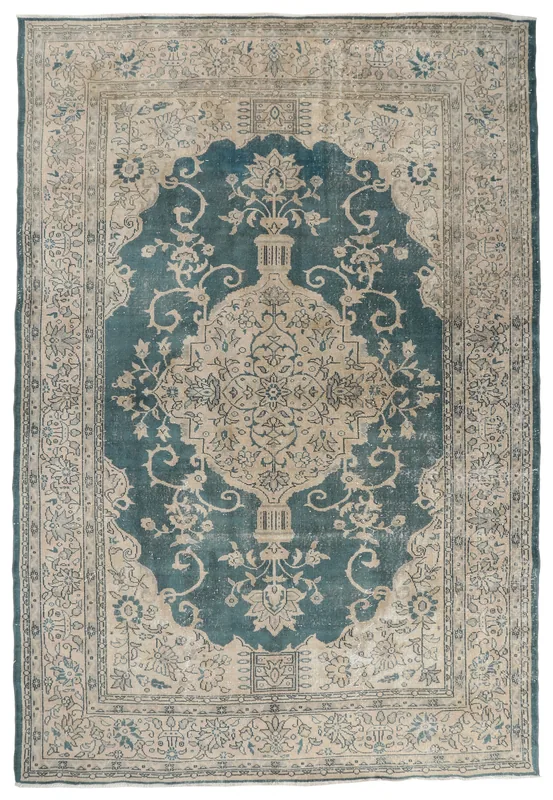 Full overhead view of the blue and beige vintage Anatolian rug with a central medallion