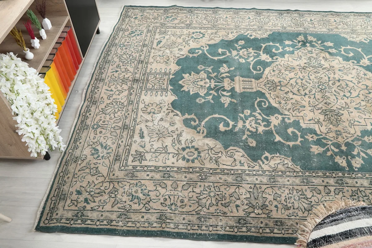 Wide angled view of the rug, capturing the full width of the border and parts of the medallion