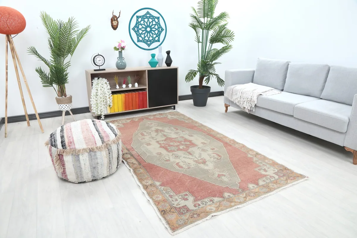 Overhead view of the rose and gray rug in a modern living room