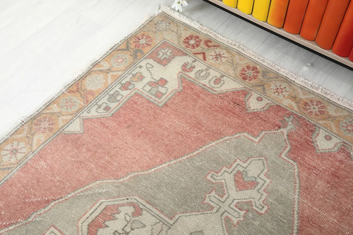 Detail of the rug's border design and a corner of the rose field
