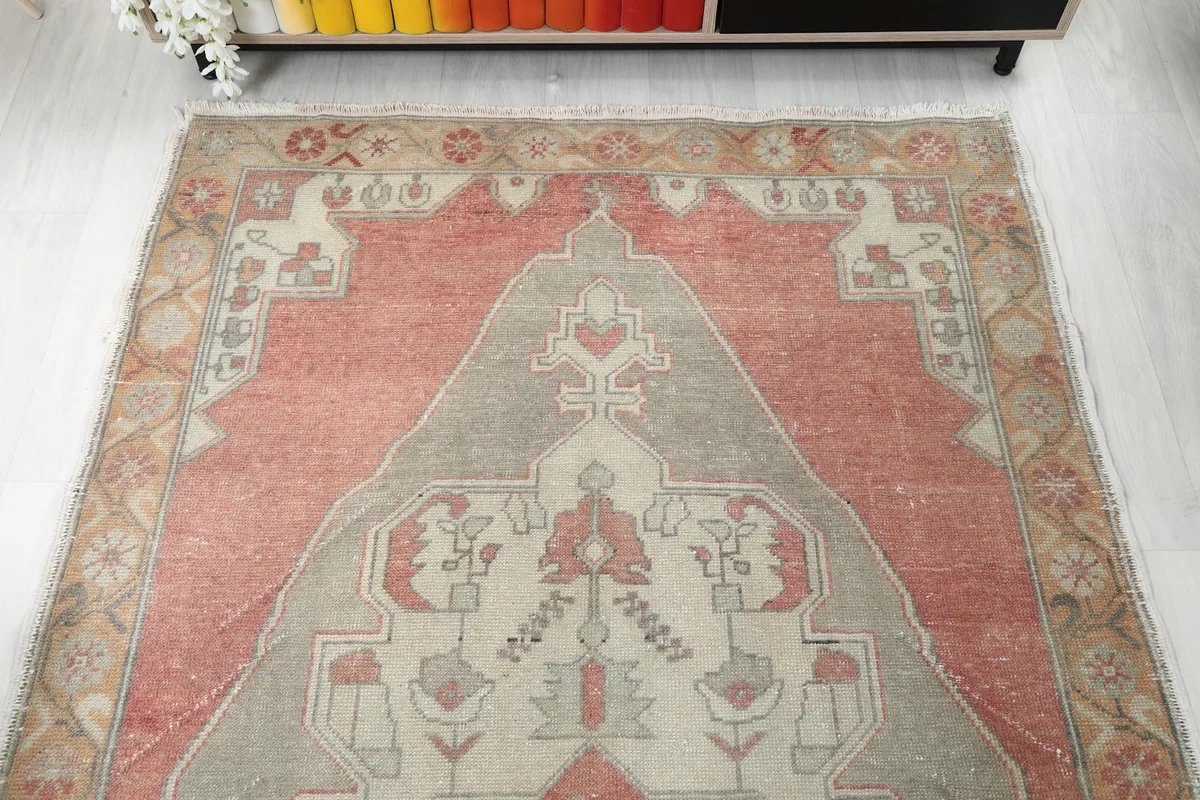 Overhead view showing the top half of the rug's design and colors