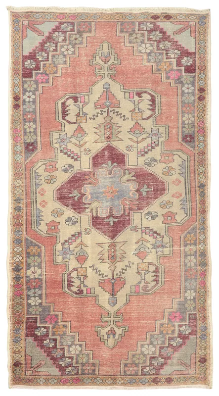 Full overhead view of the rose and beige vintage Anatolian area rug