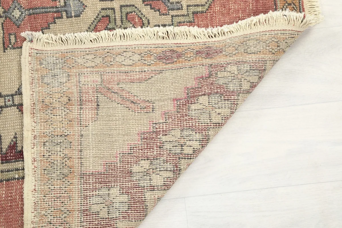 Close-up of the rug's low pile and hand-knotted wool texture