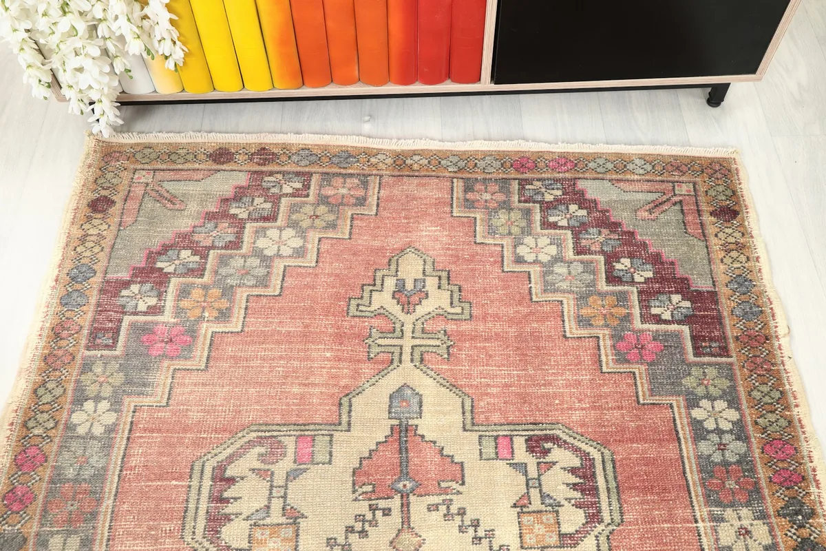 Overhead shot of one end of the rug, showing the stepped geometric designs