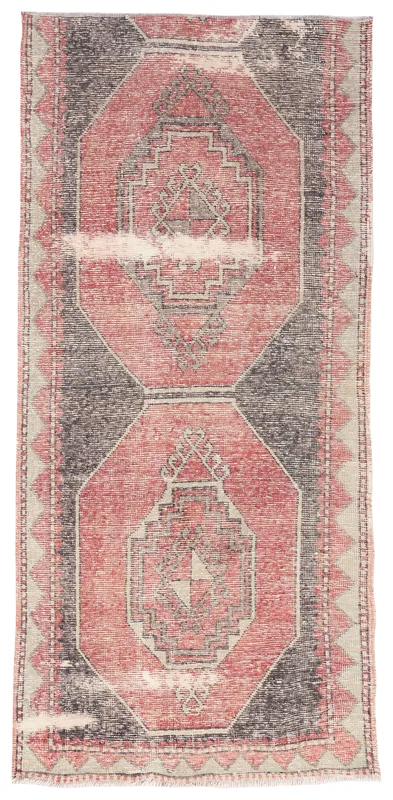 Full top view of the vintage red and charcoal geometric runner on a white background.