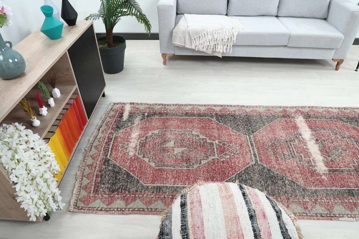 Wide shot of the red and charcoal runner in a living space, showing its scale.