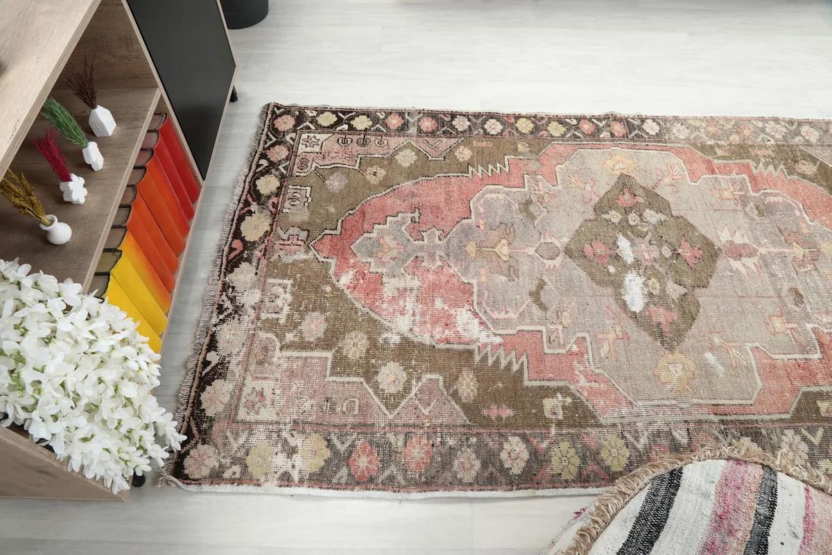 Wide angle view of the rug in a room, capturing its overall appearance and color scheme.