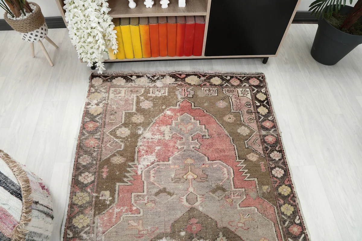 Overhead shot of the vintage Anatolian rug from one end, showing its full length and pattern.