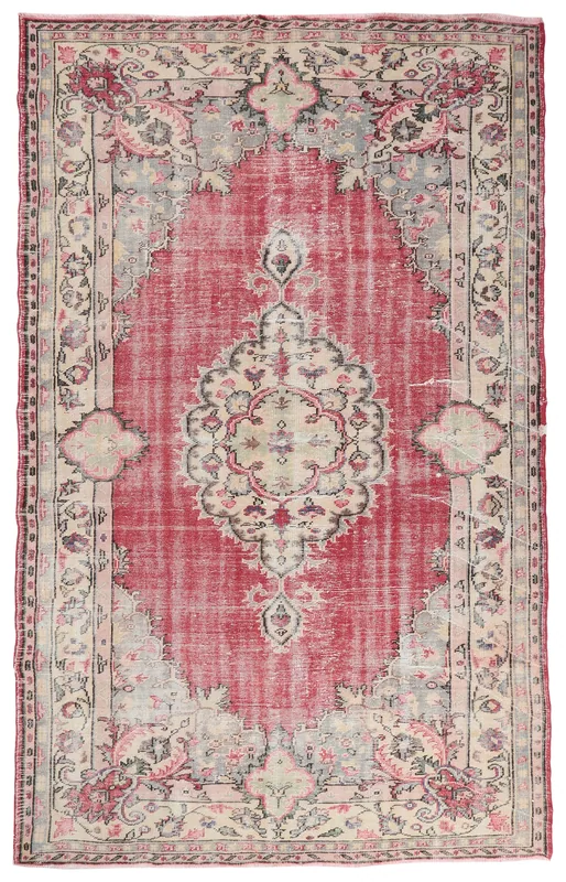 Full top view of the 6'8" x 10'9" hand-knotted vintage Anatolian rug with a red field and medallion design