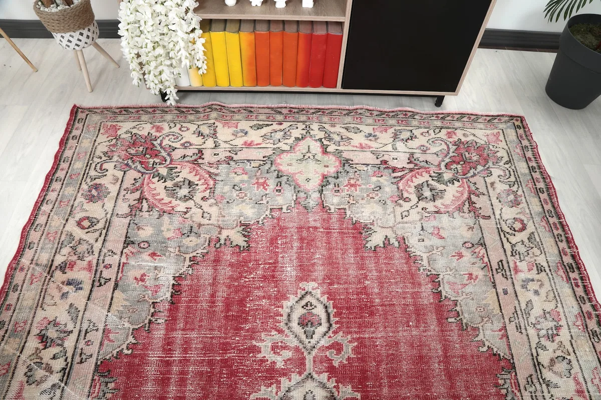 Overhead view showing the top portion of the rug, including a corner design and part of the medallion