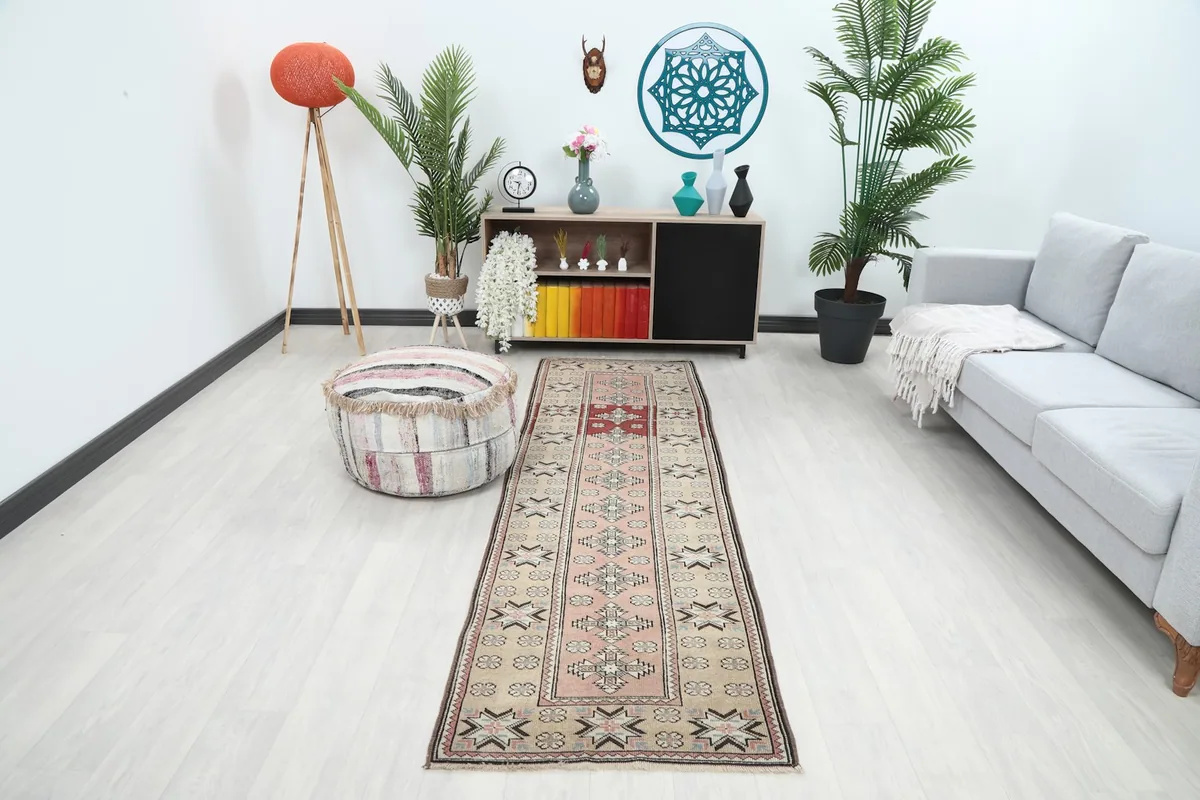 Vintage runner rug displayed in a modern hallway setting with light wood floors and minimal decor.