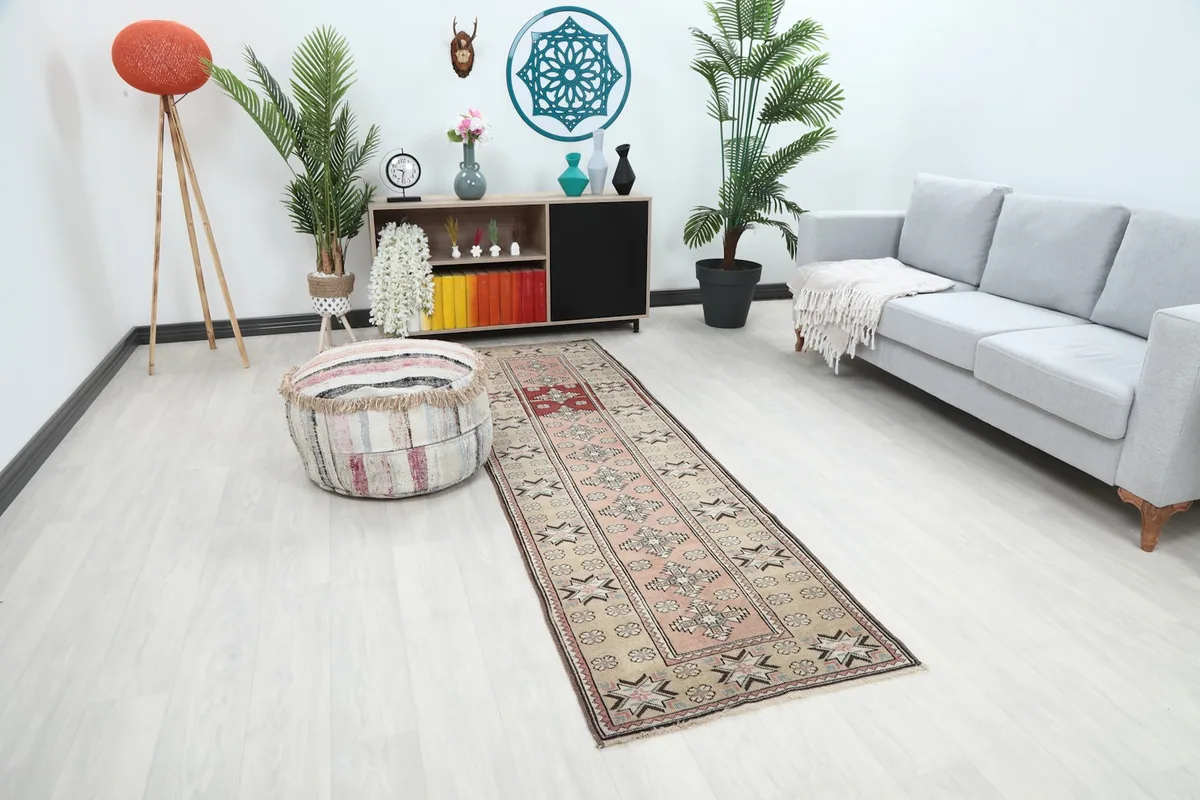 Long shot of the Anatolian runner rug from an angle, showing its full length in a room.