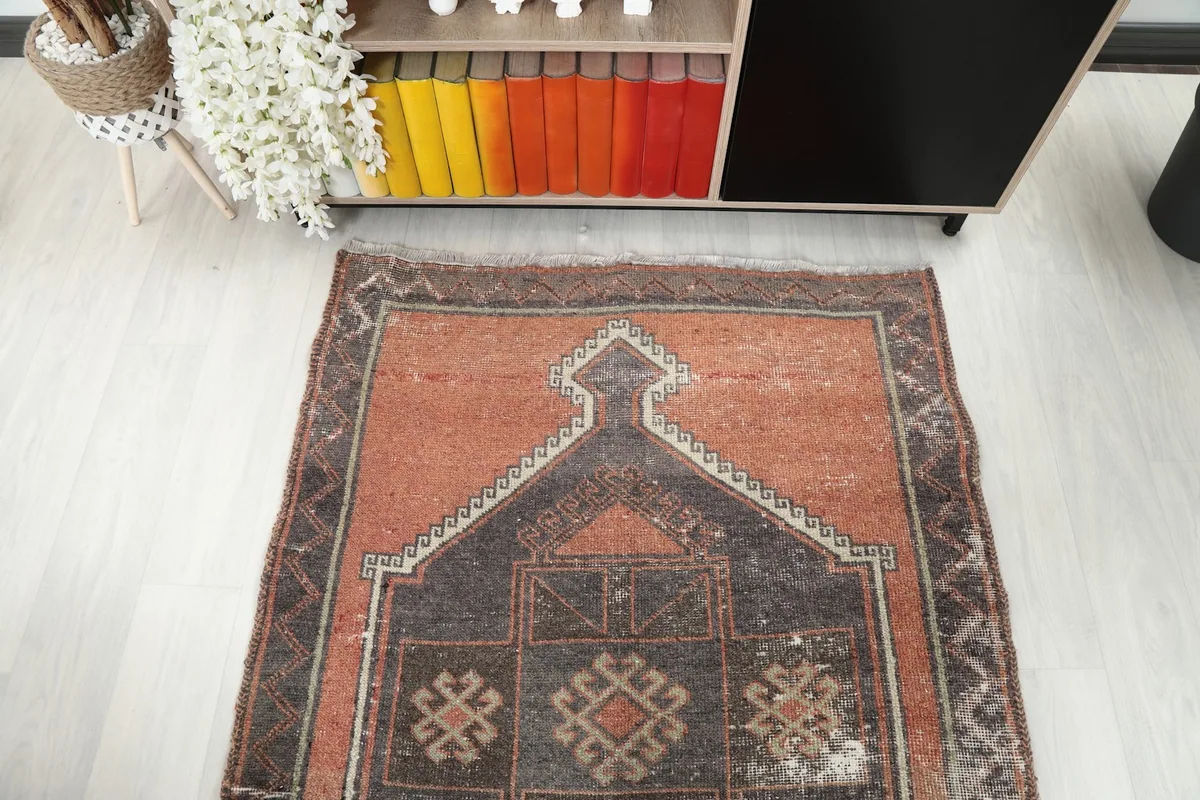Overhead view of one end of the runner rug, showcasing the large geometric motif and color blend.