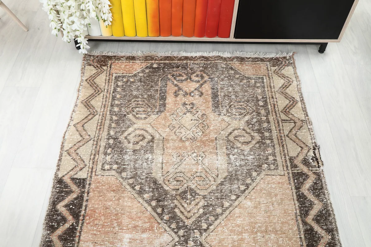 Overhead view of one end of the runner rug, displaying the full pattern repeat and border