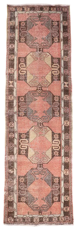 Full top view of the 3'8" x 12'5" rose geometric Anatolian runner rug on a white background